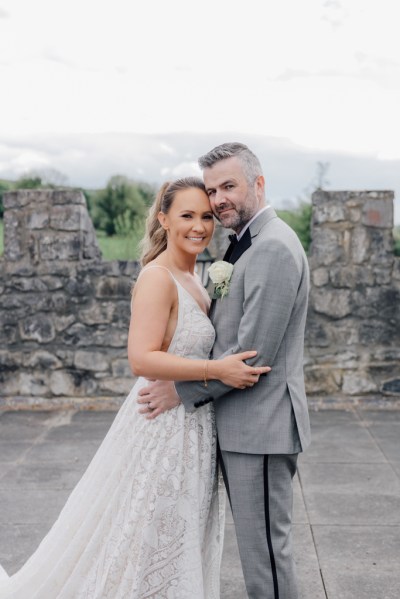 Bride and groom castle exterior rooftop