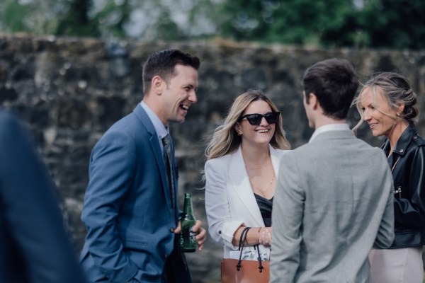 Guests chat outside exterior shot