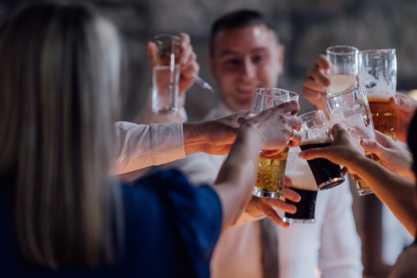 Guests cheers with Guinness wine and cocktails