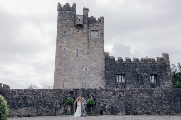 Castle exterior couple pose wide shot