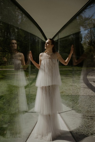 Bride wearing ruffle detail bridal gown reflection detail