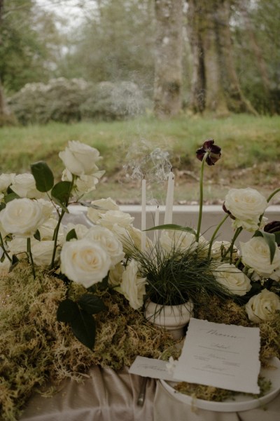 White roses flowers garden in background