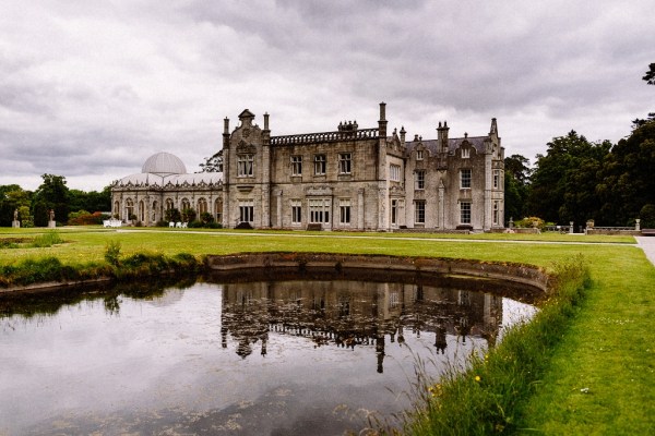 Exterior wedding venue castle lake reflection