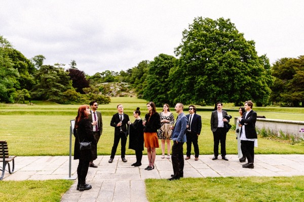 Atmosphere shot of guests on pavement and grass