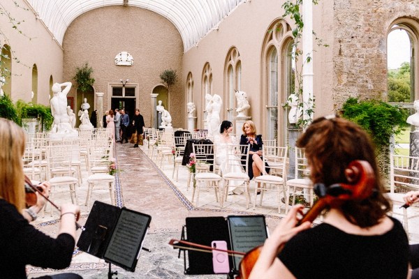 Ceremony room interior musicians playing violins