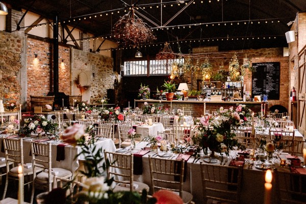 Interior wedding venue table flowers setting barn candles