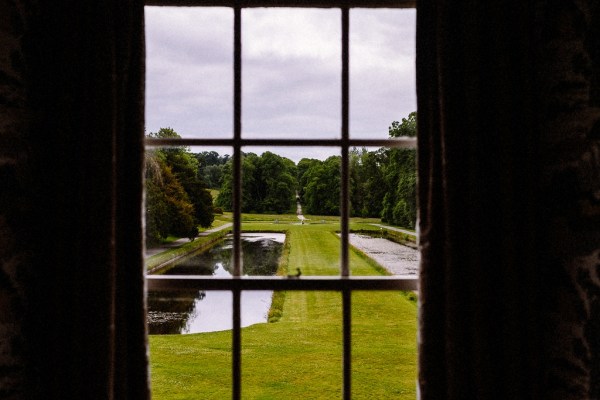 Interior shot window of exterior lake garden setting