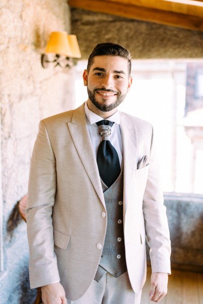 Groom getting ready smiling