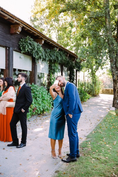 Man and woman in blue taking a selfie