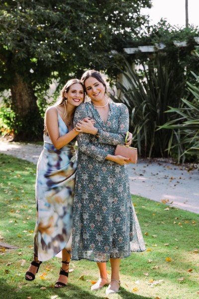 Two women pose for a photo