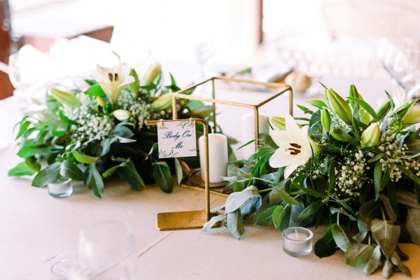 Bouquet of flowers sitting on table and candles