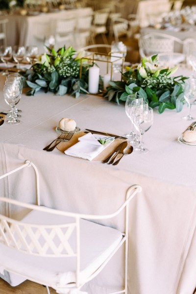 Table setting glasses and flowers on top