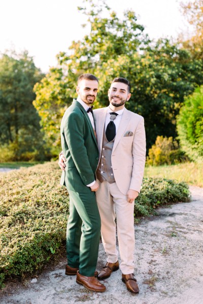 Grooms in garden smiling sunshine