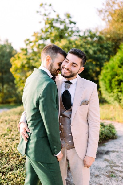 Grooms in garden smiling sunshine