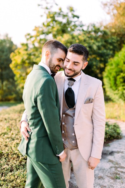 Grooms in garden smiling sunshine