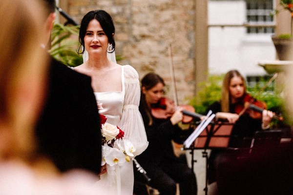 Bride in front of groom during ceremony