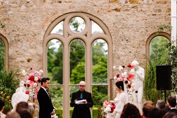 Bride groom and officiant at the alter interior church