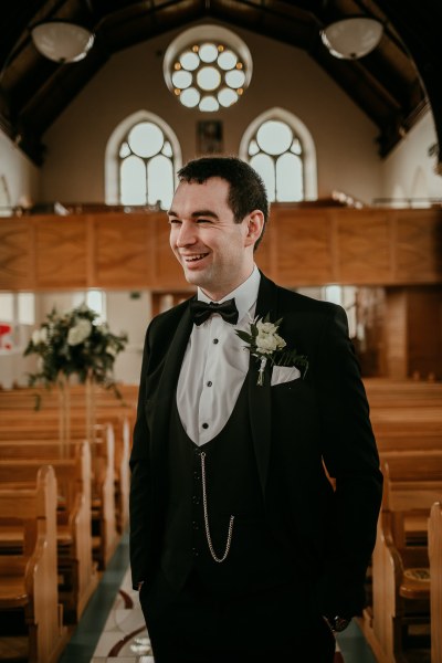 Groom at the alter empty church