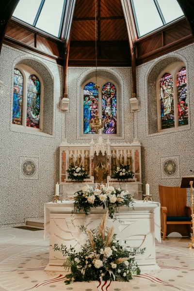 Alter detail of church and flowers lying on ground