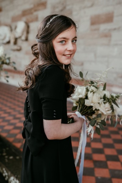 Bridesmaid Back of dress detail neckline black pillar flowers