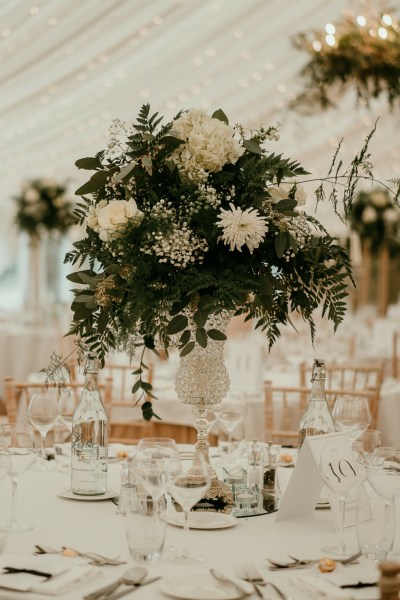 Flowers table setting cutlery glasses