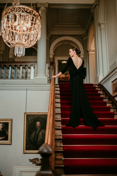 Woman in black on staircase