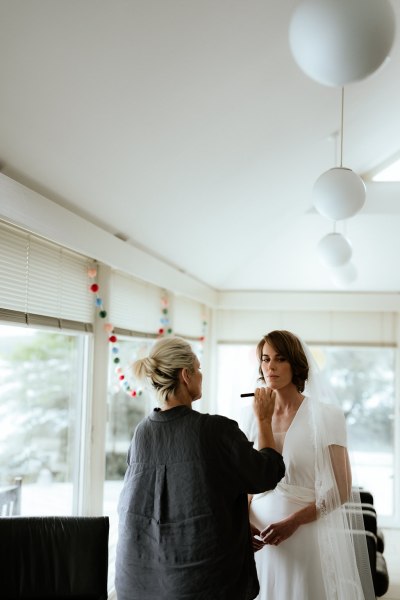 Bride gets her makeup done by MUA