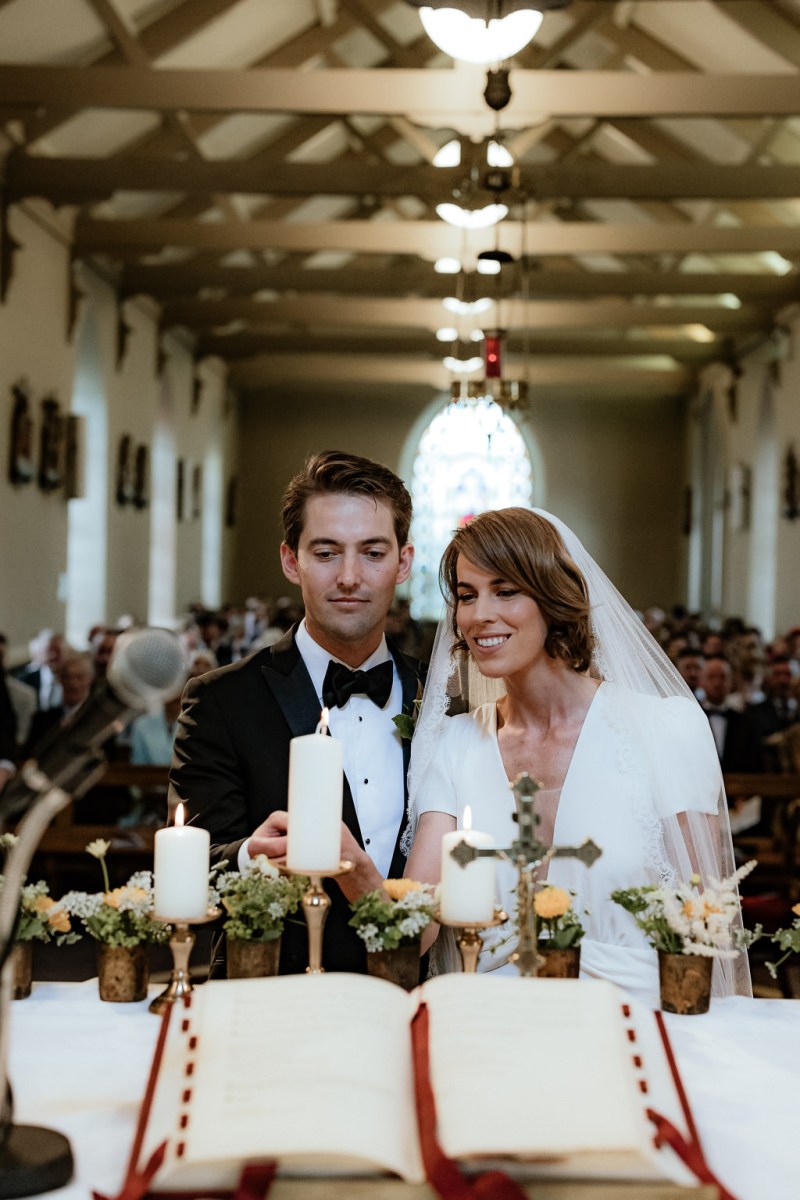 Bride and groom at at the alter candles lit