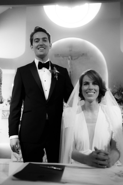 Black and white image of bride and groom in church