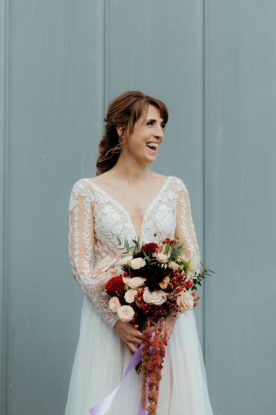 Bride laughs and looks to her right