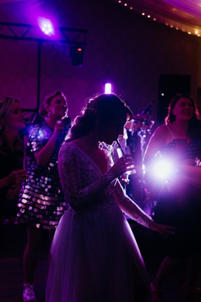 Purple hue and bride drinking drink