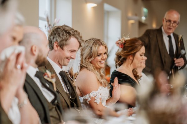 Bride and groom smile