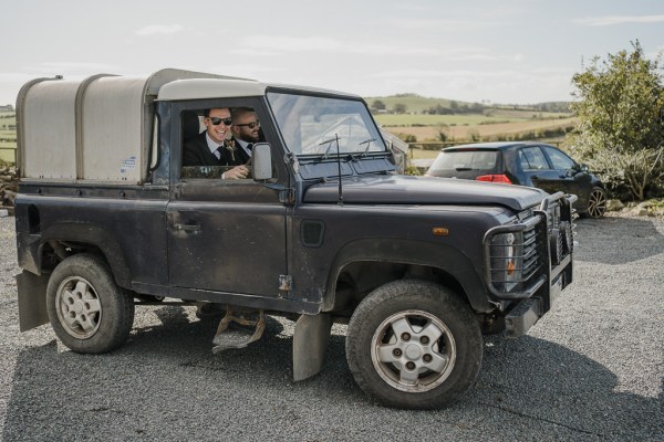 Groom in car with groomsman