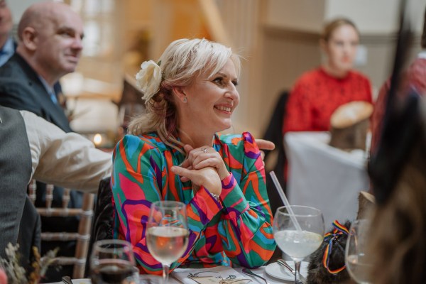 Woman smiles at dining room table