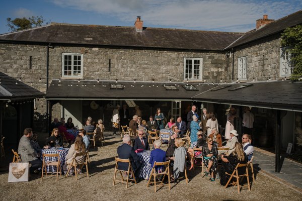 Atmosphere shot of guests exterior sunshine