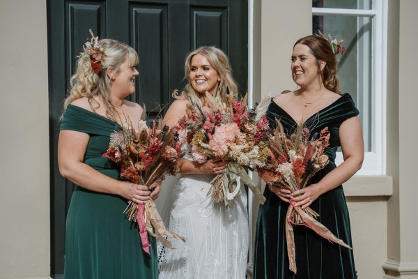 Bride and bridesmaids look at each other