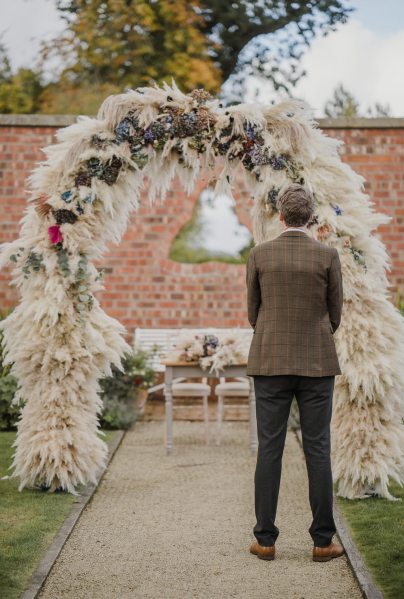 Groom waits for bride at alter