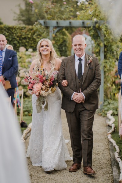 The father of the bride walks down the aisle together