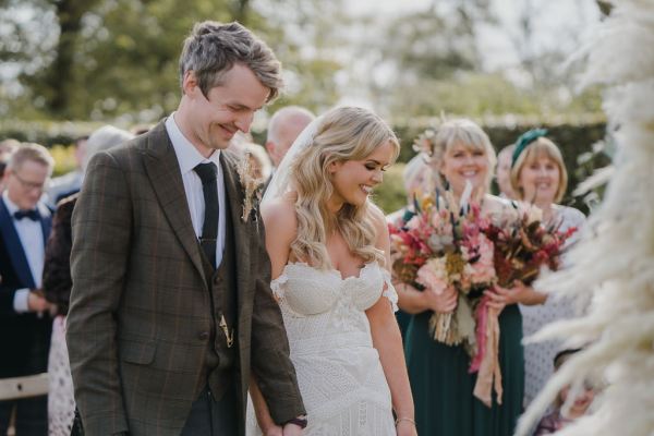 Bride and groom smile