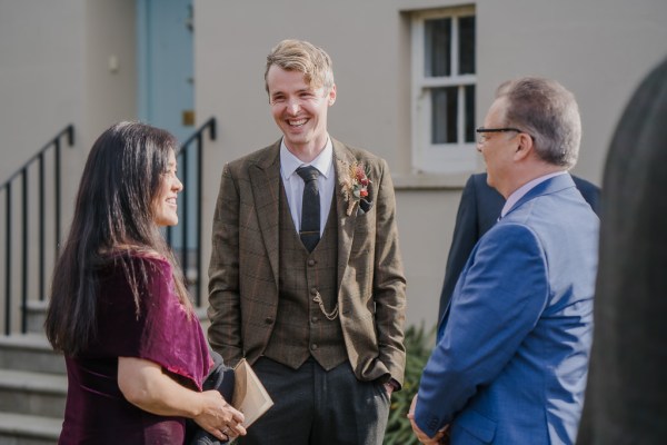 Groom chats amongst friends