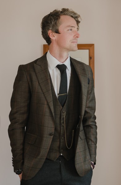 Groom ready in his suit and tie shirt