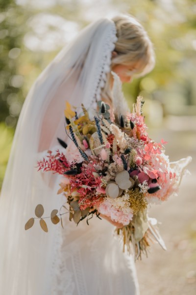 Close up of flowers bride looking down