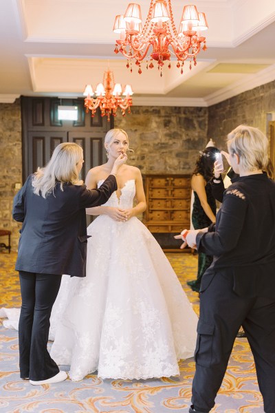 Bride makeup artist and other members of family help her get ready