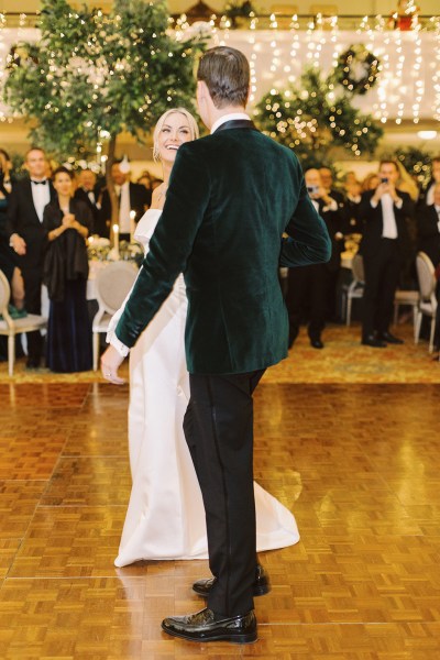 Bride and groom enter ballroom hand in hand dance