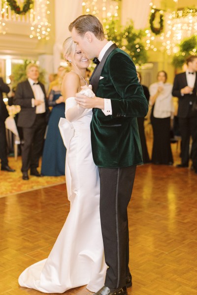 Bride and groom dance on the dancefloor in front of guests