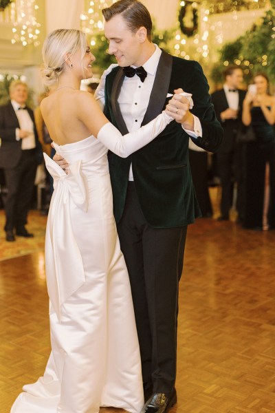 Bride and groom dance on the dancefloor in front of guests