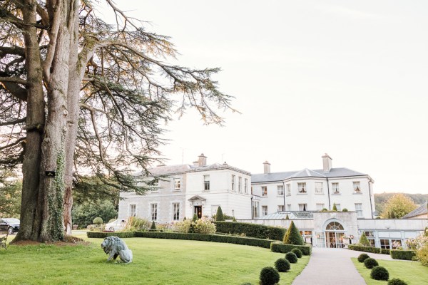 White exterior wedding venue and grass setting