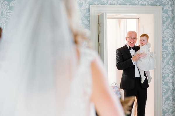 Father and little girl baby see bride for the first time