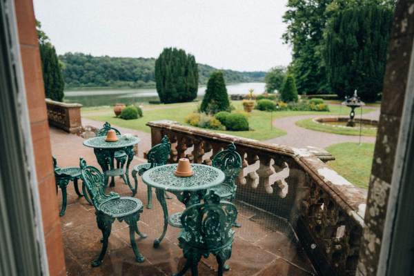 Exterior balcony shot table and chairs wedding venue