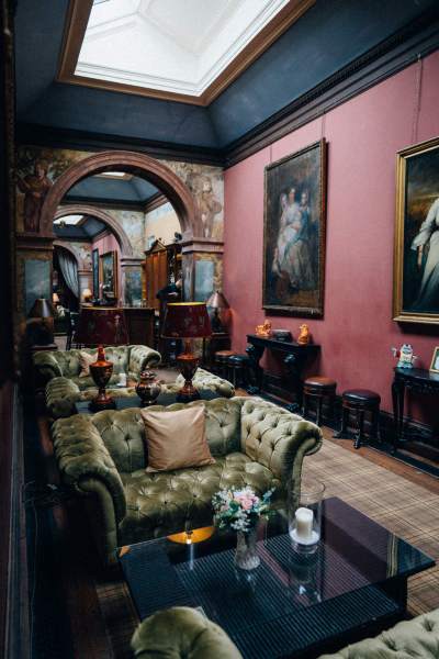 Interior dining room stately home manor portraits paintings in shot